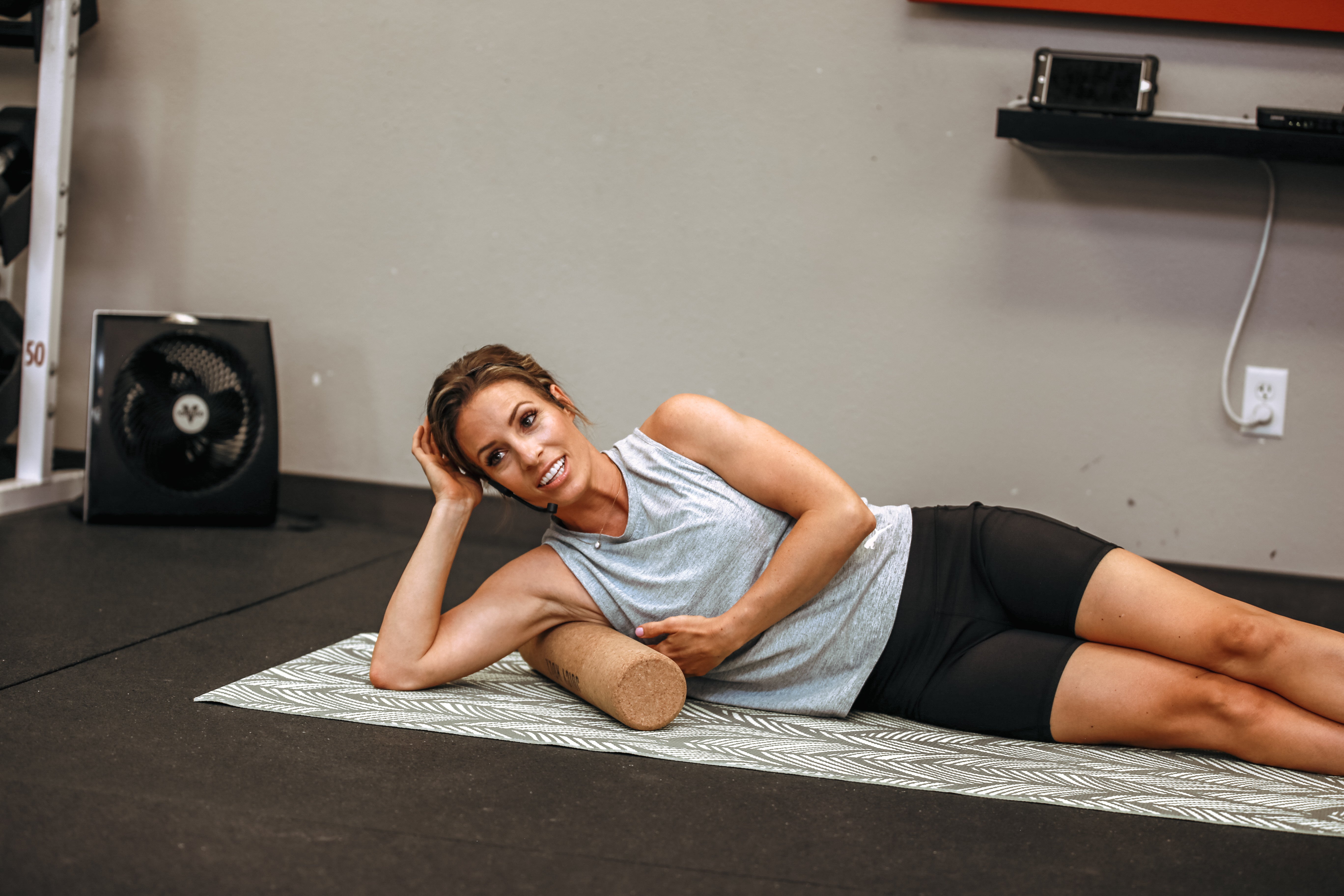 Woman rolling her side body with the Juicy Roll during a Juicy Roll Method practice